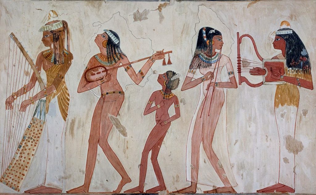 young women musicians and young girl dancer in ancient Egypt
